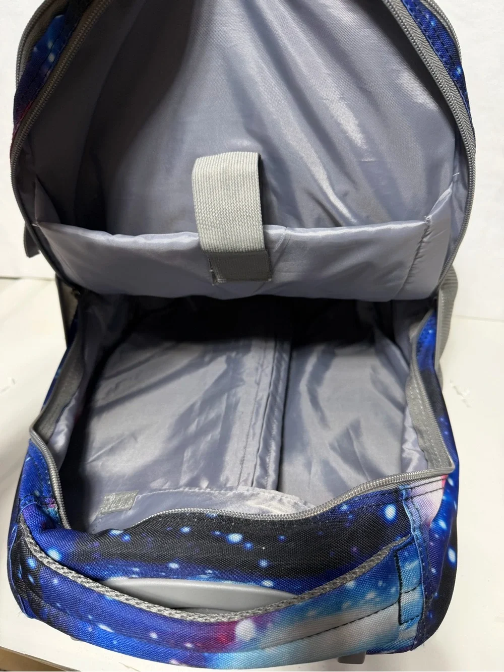 Tilami Deep Blue Galaxy Rolling Backpack 19 inch - pre owned condition